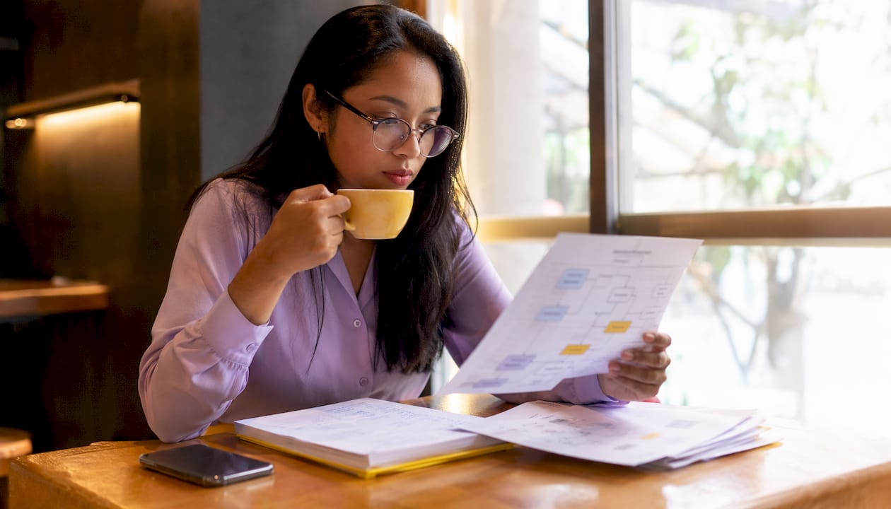 Customer success manager reviewing escalation flowcharts