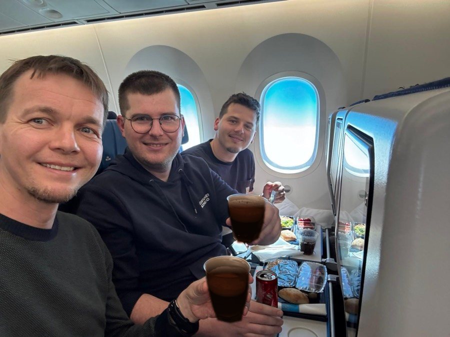 Three of the team on a plane heading to Austin, Texas