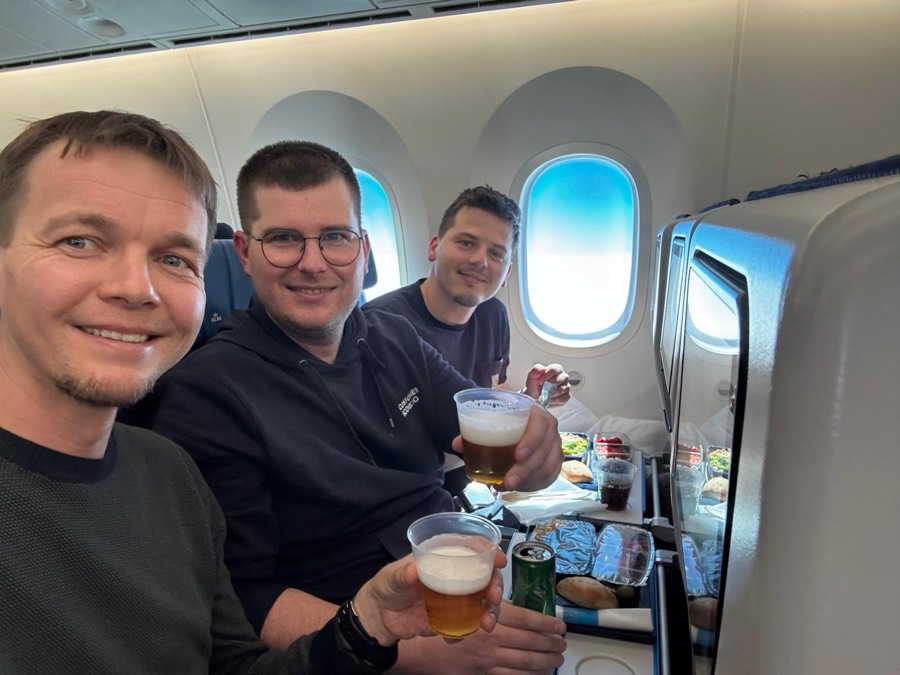 Three of the team on a plane heading to Austin, Texas
